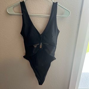 Size Small. Never worn, fits like a smaller medium. Open back.